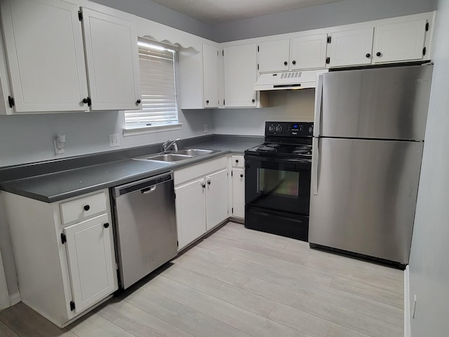 kitchen with white cabinetry, sink, stainless steel appliances, and light wood-type flooring