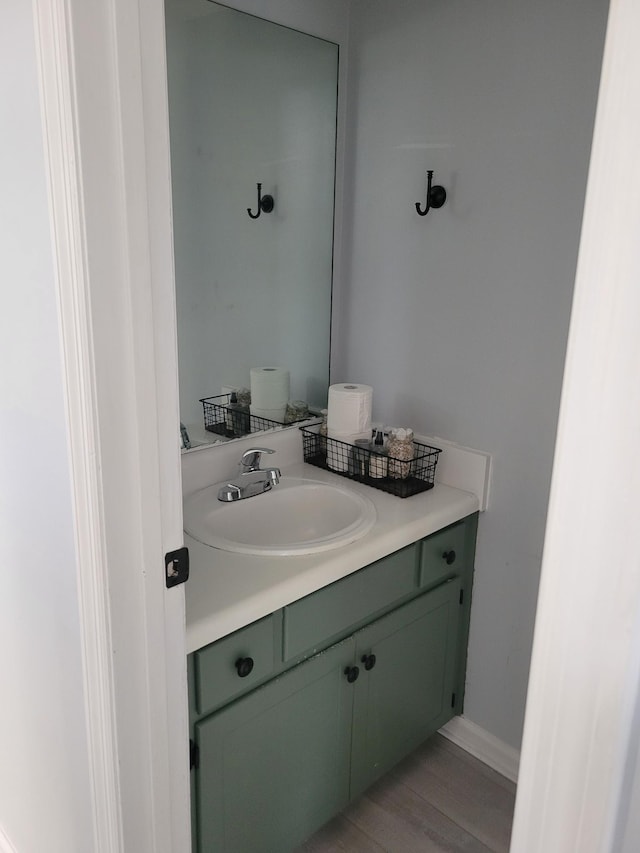 bathroom featuring hardwood / wood-style floors and vanity