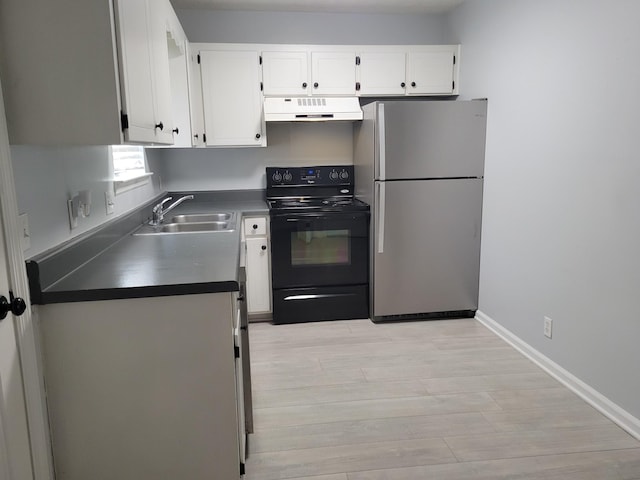 kitchen featuring stainless steel fridge, black electric range oven, white cabinetry, and sink