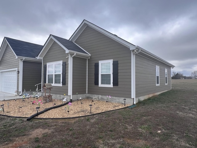 view of property exterior with a garage