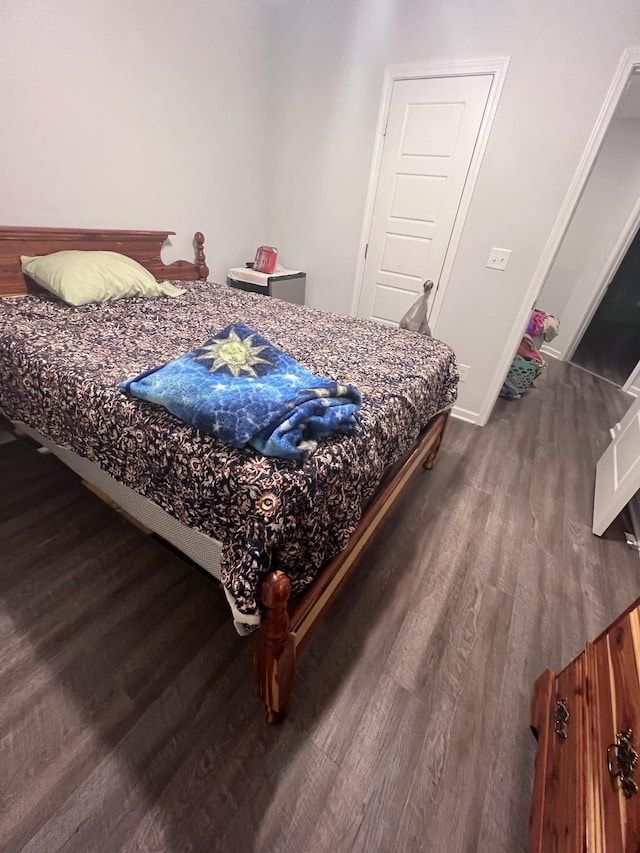 bedroom featuring dark hardwood / wood-style floors