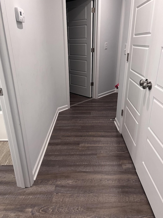 hallway featuring dark hardwood / wood-style floors