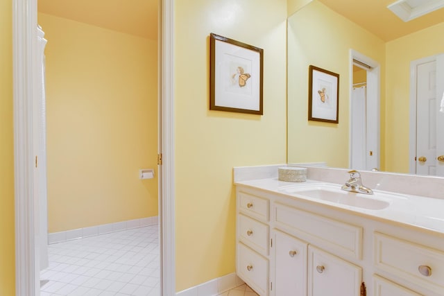 bathroom featuring tile patterned flooring and vanity