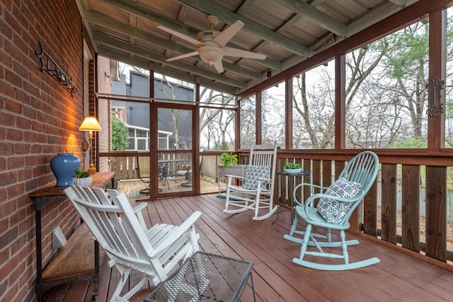 sunroom featuring wood ceiling, a wealth of natural light, lofted ceiling, and ceiling fan