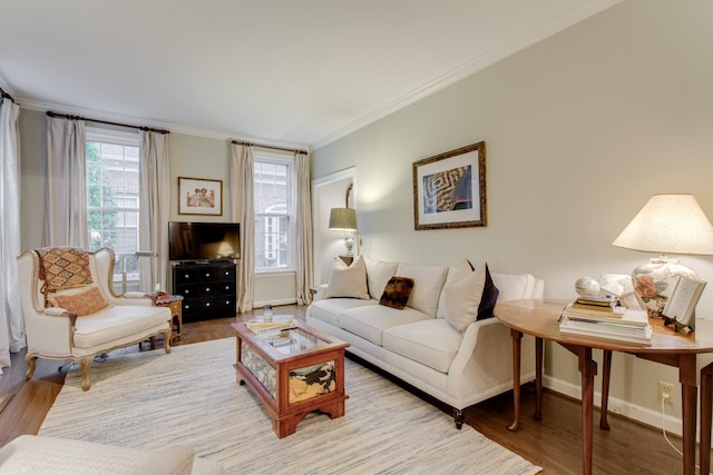 living room featuring crown molding and hardwood / wood-style flooring