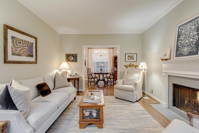 living room featuring hardwood / wood-style floors, crown molding, and a chandelier