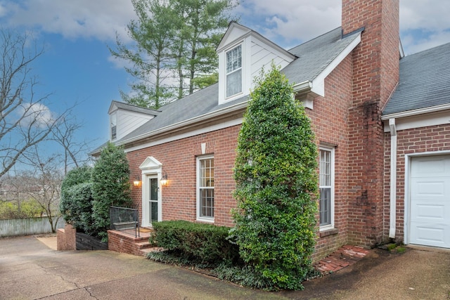 view of side of home with a garage