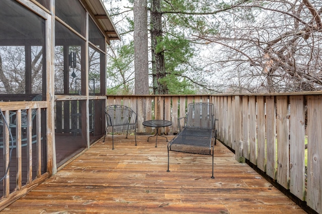 wooden terrace featuring a sunroom