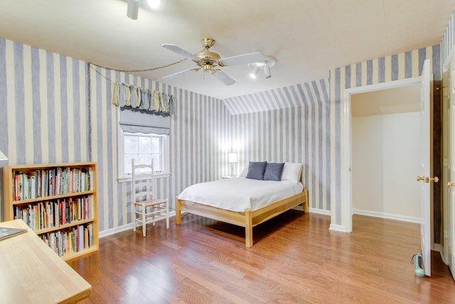 bedroom featuring hardwood / wood-style flooring and ceiling fan