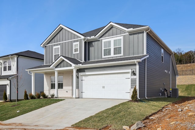 view of front of home with brick siding, central AC unit, board and batten siding, a garage, and driveway