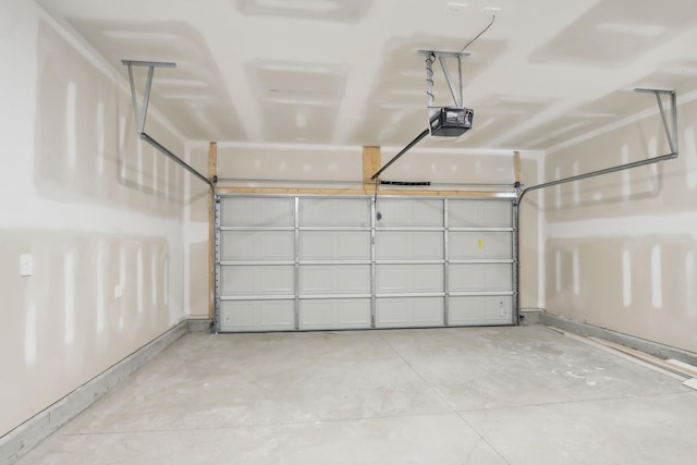 garage with baseboards and a garage door opener