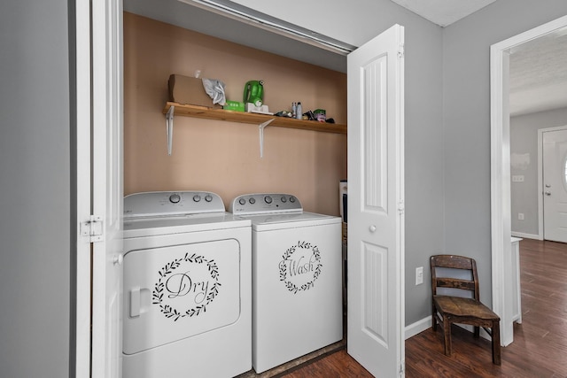 laundry room with dark wood-type flooring and washing machine and clothes dryer