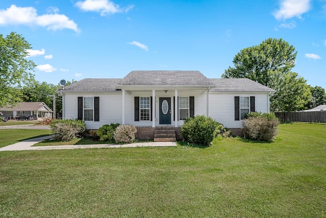 single story home featuring a porch and a front yard