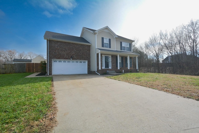 view of front property featuring covered porch, a garage, and a front lawn