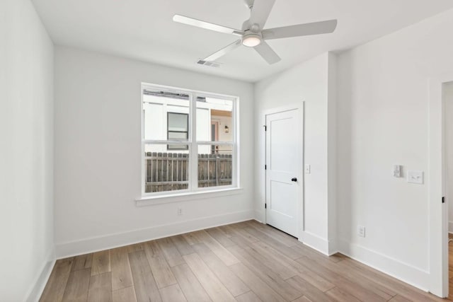 unfurnished room with ceiling fan and light hardwood / wood-style flooring