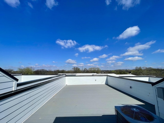 wooden terrace featuring central AC unit