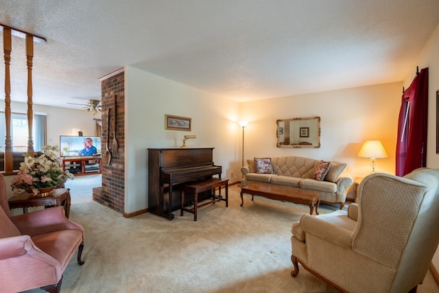 carpeted living room with a textured ceiling and ceiling fan