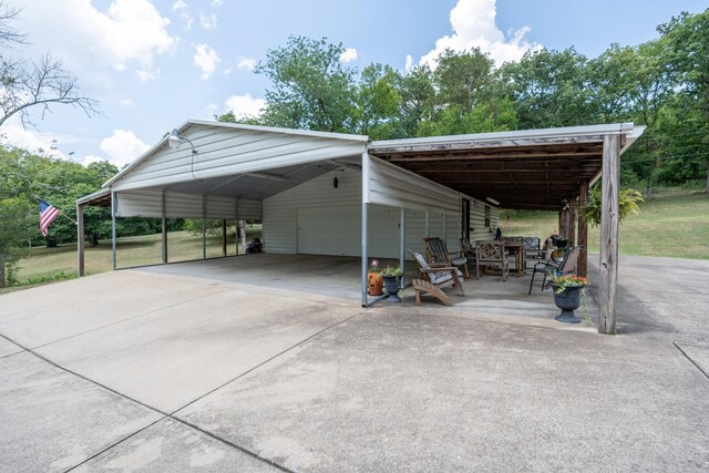 view of vehicle parking featuring a carport