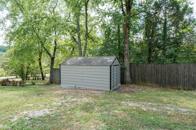 view of outbuilding featuring a lawn