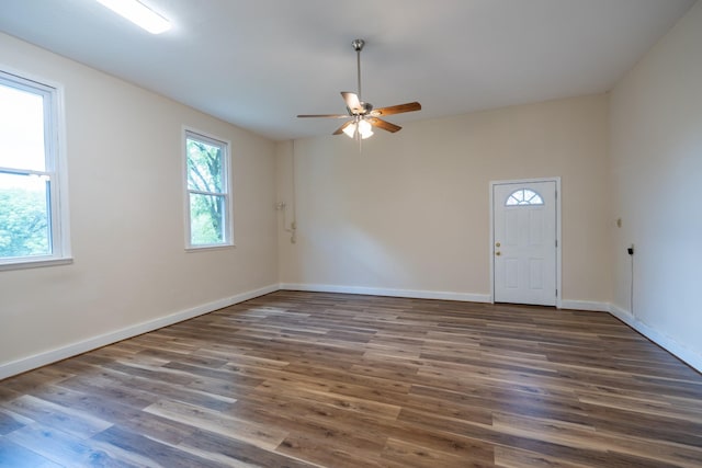 spare room featuring ceiling fan and dark hardwood / wood-style flooring