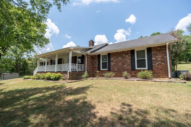 ranch-style home with covered porch and a front lawn