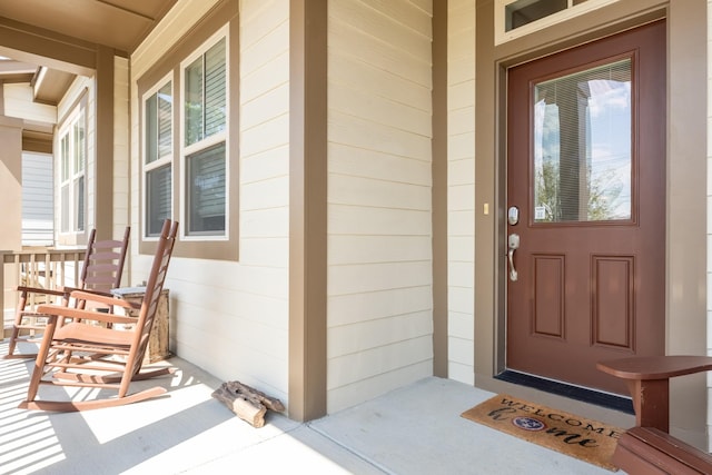 property entrance with covered porch