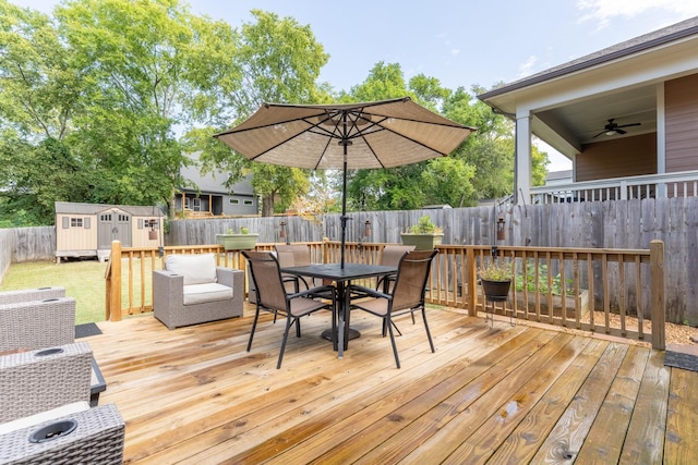 wooden terrace with a shed