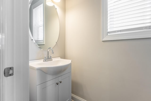 bathroom with plenty of natural light and vanity