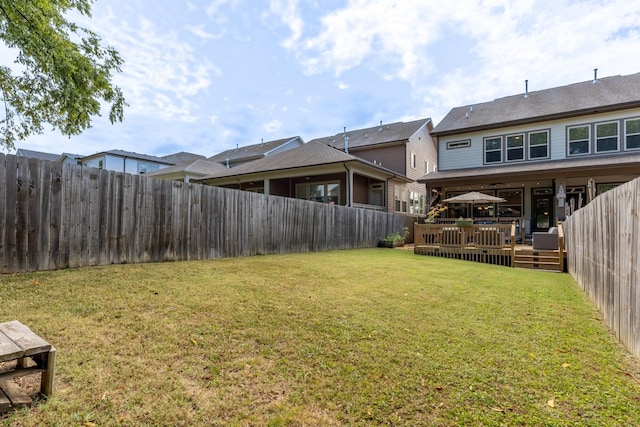 view of yard featuring a wooden deck