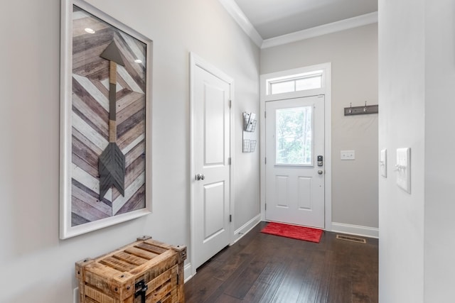 entryway featuring ornamental molding and dark wood-type flooring