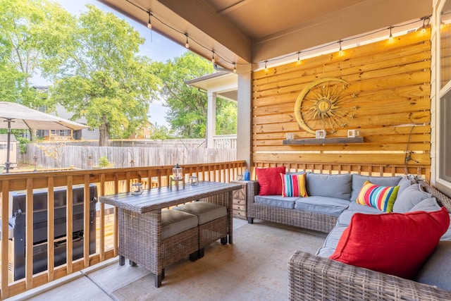 deck with outdoor lounge area, area for grilling, and a patio