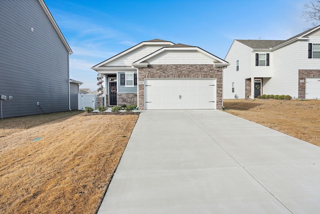 view of front of home featuring a garage and a front lawn