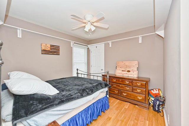 bedroom featuring ceiling fan and hardwood / wood-style floors