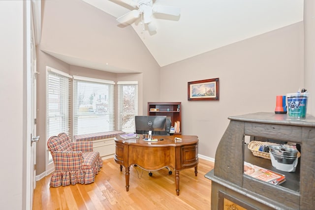 office with hardwood / wood-style flooring, ceiling fan, and high vaulted ceiling