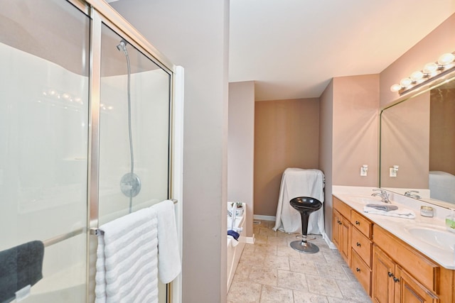 bathroom featuring vanity and independent shower and bath