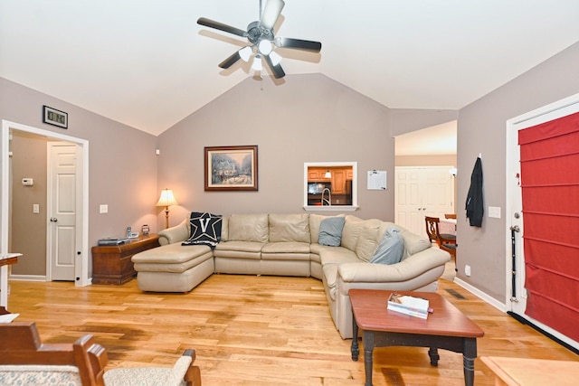 living room featuring light wood-type flooring, ceiling fan, and lofted ceiling