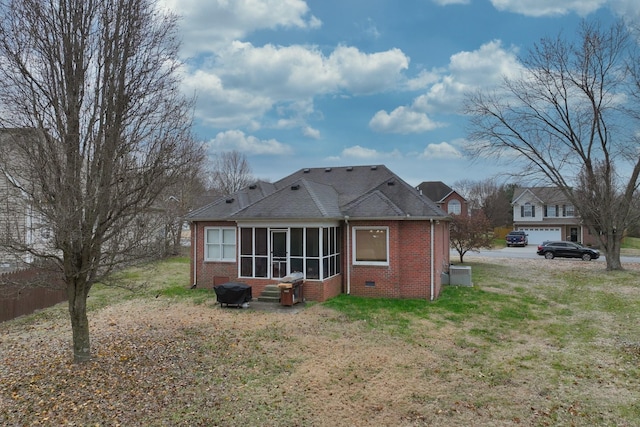 rear view of property with a yard