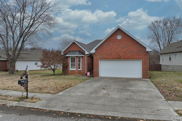 view of front of house with a garage and a front yard