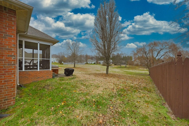 view of yard with a sunroom