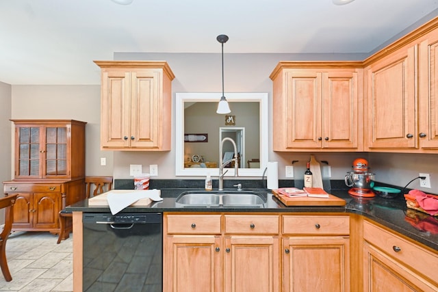 kitchen featuring decorative light fixtures, sink, and black dishwasher