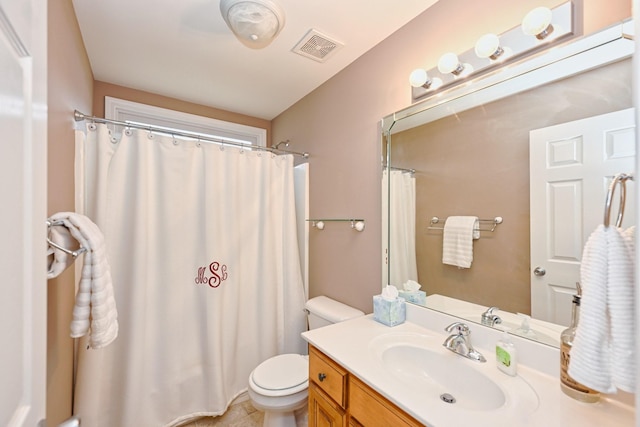 bathroom with a shower with shower curtain, vanity, and toilet