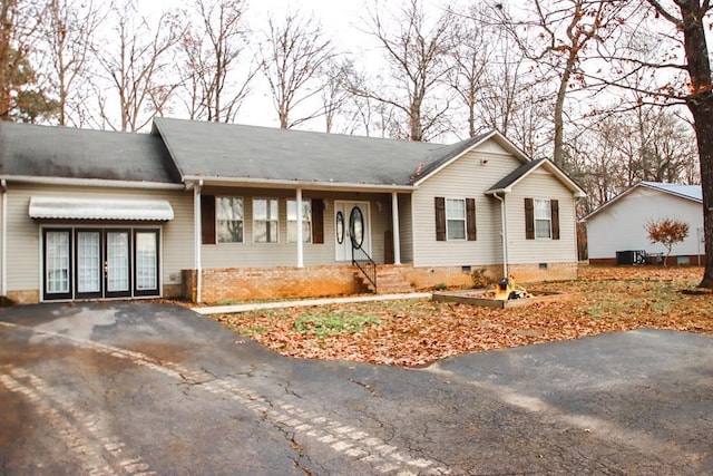 ranch-style home with central air condition unit