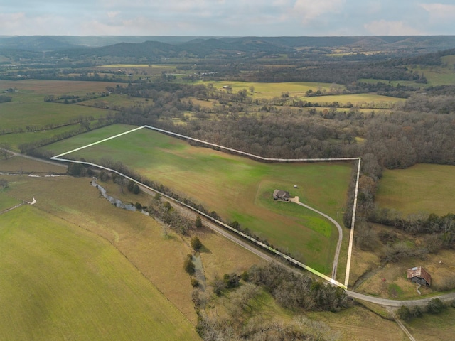 birds eye view of property featuring a rural view