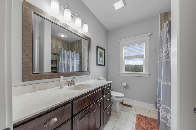 bathroom featuring tile patterned floors, curtained shower, vanity, and toilet