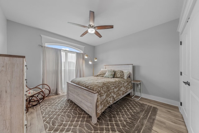 bedroom featuring hardwood / wood-style floors and ceiling fan