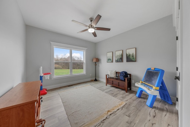 sitting room featuring light hardwood / wood-style floors and ceiling fan