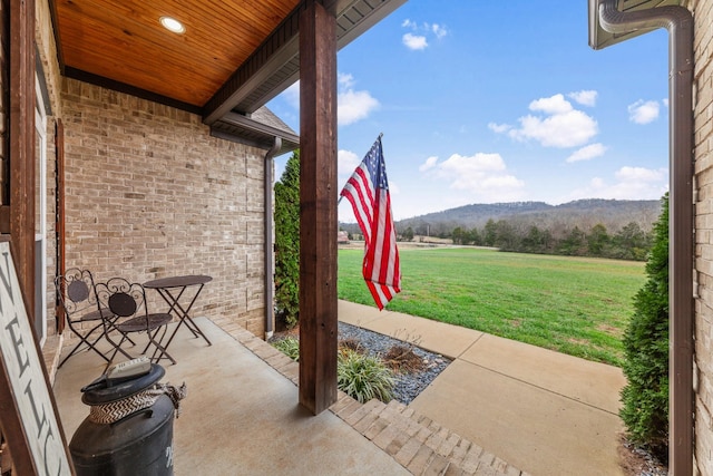 view of patio / terrace featuring a mountain view