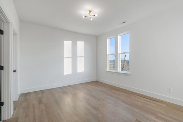 unfurnished room featuring light hardwood / wood-style floors