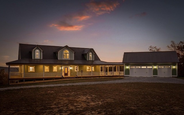 3868 Hobbstown Rd, Dunlap, TN 37327 - country-style home featuring a garage, gravel driveway, covered porch, and a metal roof