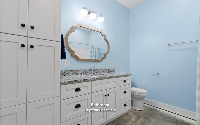 bathroom featuring tile patterned flooring, vanity, and toilet